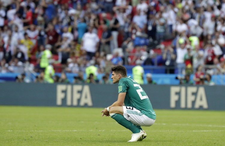 Germany's Mario Gomez kneels on the pitch after the match between South Korea and Germany, at the 2018 World Cup in Russia on Wednesday. The Koreans won, 2-0.