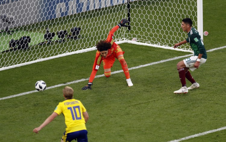 Mexico's Edson Alvarez scores an own goal past his goalkeeper during the match between Mexico and Sweden at the 2018 World Cup in Russia on Wednesday.