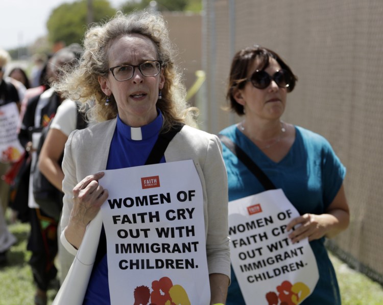 Clergy with Women of Faith show support for detained immigrants outside a U.S. Customs and Border Patrol processing center Wednesday in McAllen, Texas.
