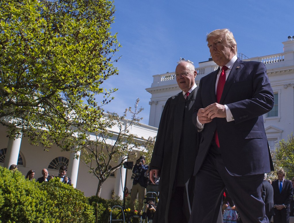 President Trump and Justice Anthony Kennedy walk together after Justice Neil Gorsuch was administered the oath of office on April 10, 2017.  Trump said he asked Kennedy for suggestions on his successor.