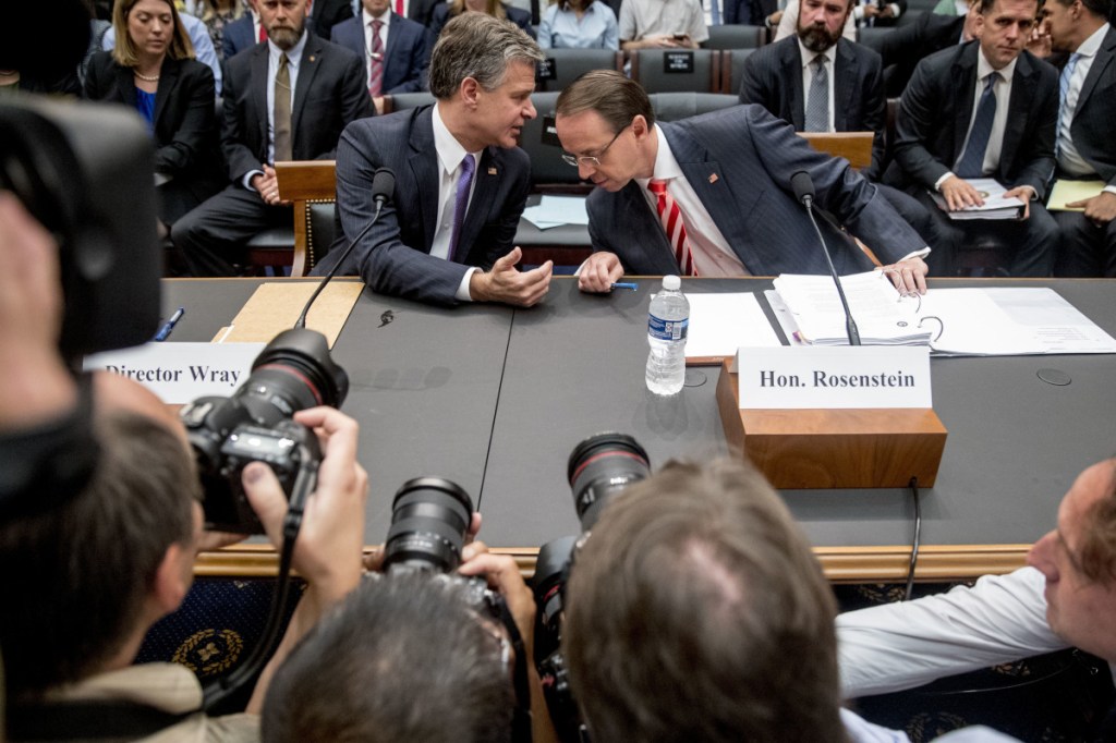 Deputy Attorney General Rod Rosenstein, right, and FBI Director Christopher Wray, left, arrive to testify before a House Judiciary Committee hearing on Capitol Hill in Washington, Thursday, June 28, 2018, on Justice Department and FBI actions around the 2016 presidential election. Associated Press/Andrew Harnik