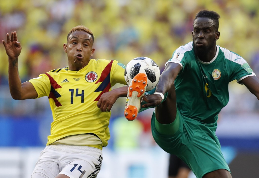 Salif Sane, right, and his Senegal teammates were moving out instead of moving on at the World Cup because they accumulated more yellow cards than Japan – a new tiebreaker.