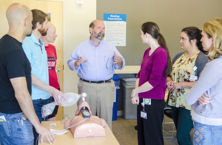Rick Petrie, executive director of Atlantic Partners EMS, talks to a group of residents Friday after they finished an advanced cardiac life support class in Augusta.