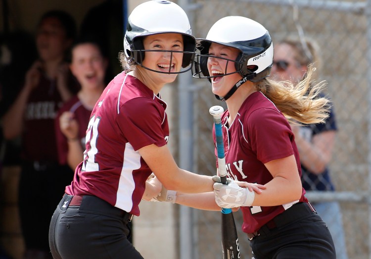 Mollie Obar of Greely celebrates with Sawyer Dusch, right, after coming in to score the game's only run in the third inning.