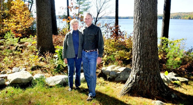 Phyllis and Lynn Matson stand beside a wooded buffer zone between their home and Long Pond in Rome in this Oct. 21, 2012, file photo. The Matsons, who were honored with a LakeSmart award at the time, have donated property for a public park on a triangle of land between Route 27 and West Road in Belgrade.