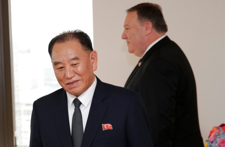Kim Yong Chol, former North Korean military intelligence chief and one of Kim Jong Un's closest aides, left, and U.S. Secretary of State Mike Pompeo take their places at the table before a meeting Thursday in New York. 