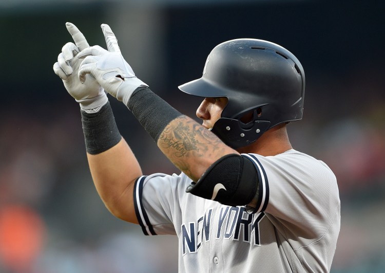 New York Yankees' Gleyber Torres gestures at first base after he singled during the third inning of the Yankees 4-1 win over the Orioles on Friday in Baltimore. 