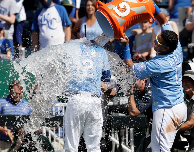 Kansas City's Jorge Soler  is doused by teammate Salvador Perez following the Royals' 5-4 win over the Oakland Athletics on Saturday in Kansas City, Mo. 