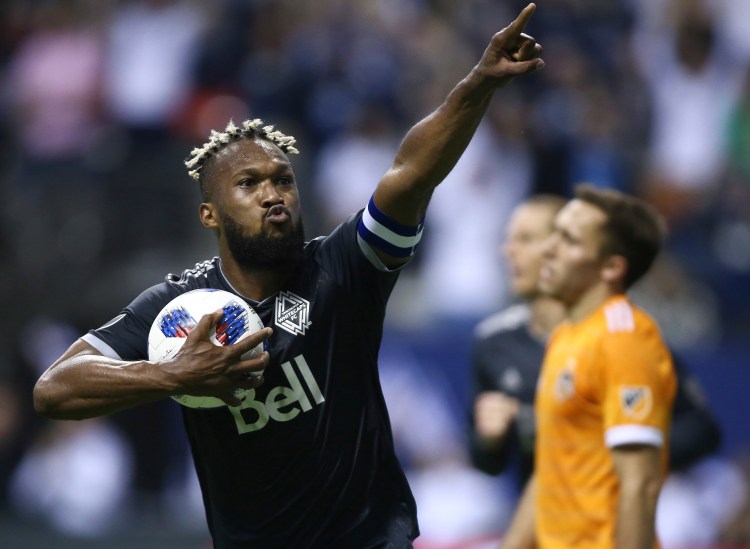 Vancouver Whitecaps defender Kendall Waston celebrates his goal against the Houston Dynamo during the second half of an MLS soccer match in Vancouver, British Columbia. When it was announced Waston would be part of Costa Rica’s 23-man roster headed to Russia for the World Cup, he was surrounded by his Whitecaps teammates, the announcement made by the club’s head coach Carl Robinson. The applause, the good wishes, the water-bottle shower that followed was a sign of the respect and admiration Waston has earned during the time with his club. 