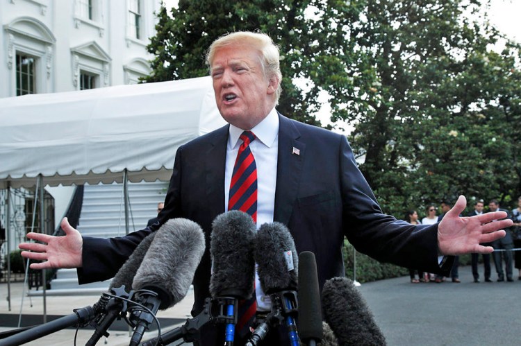President Trump speaks to reporters before leaving the White House Friday to attend the G7 Summit in Charlevoix, Quebec, Canada. 