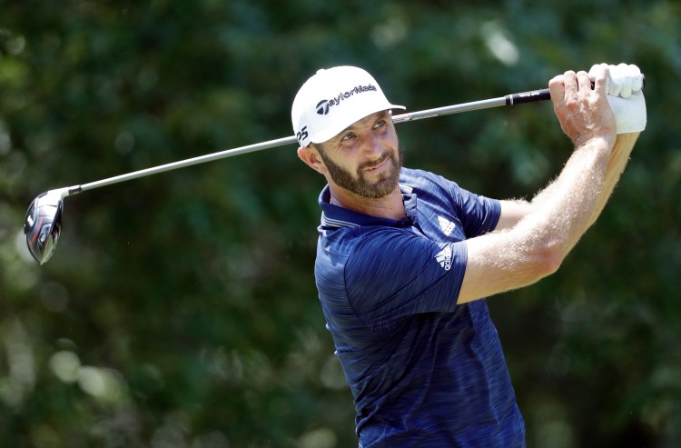 Dustin Johnson watches his drive on the seventh hole during the final round of the St. Jude Classic on Sunday in Memphis, Tenn. Johnson eagled the final hole and won the tournament by six shots.