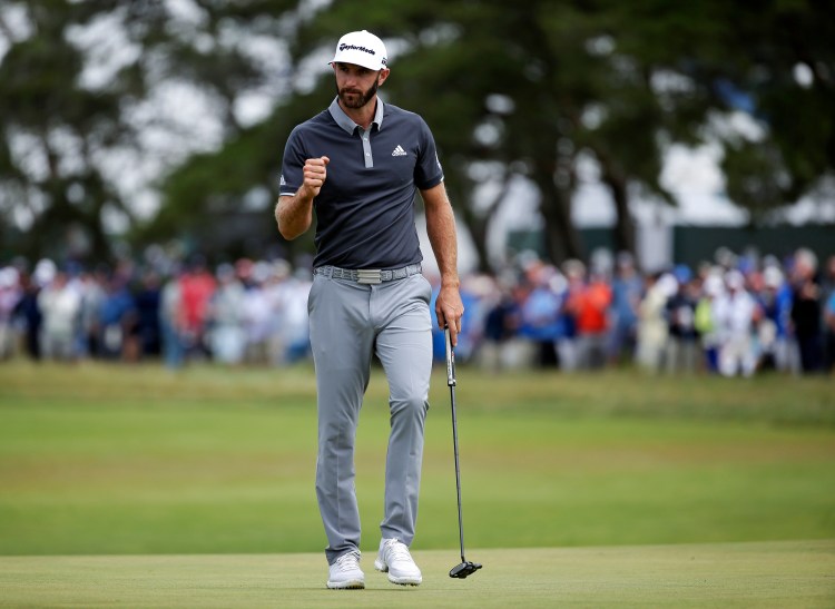 Dustin Johnson reacts after making a putt for birdie on the fourth green during the second round of the U.S. Open on Friday in Southampton, N.Y. Johnson has a four-shot lead after the second round. 
