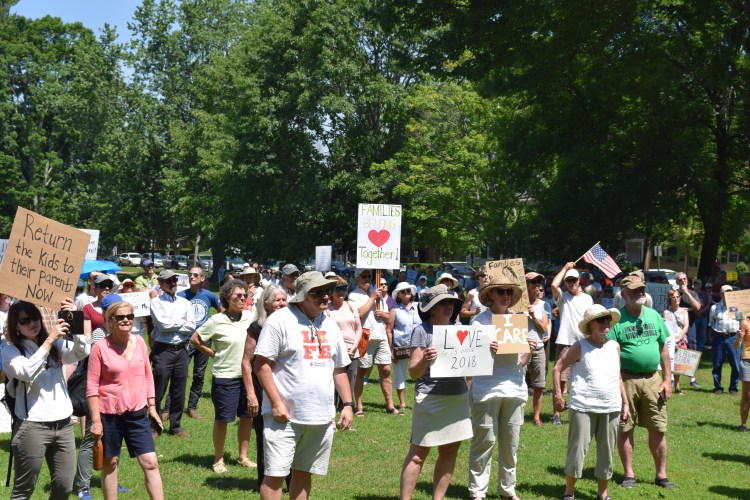 A crowd gathered on Brunswick's Town Mall on Saturday June 30, 2018 to protest the Trump administration's immigration policies, in particular the practice of separating children from their parents in makeshift detention facilities at the southern border.