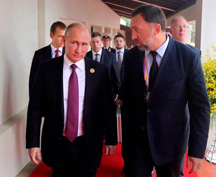 Russian metals magnate Oleg Deripaska, right, and Russian President Vladimir Putin in Danang, Vietnam in 2017.