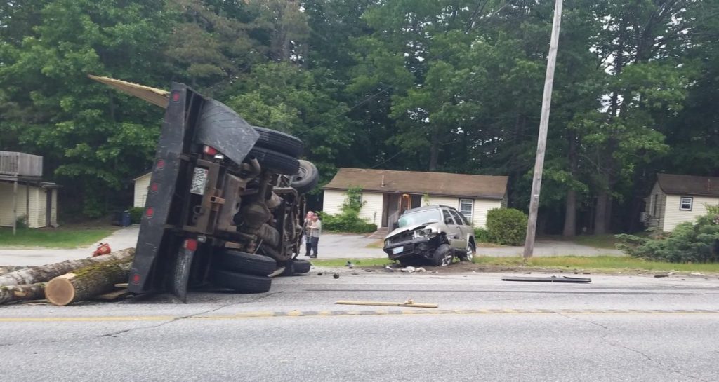 A crash involving a logging truck shut down part of Route 302 in Windham on Tuesday evening.