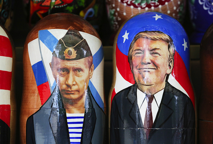 Souvenir matryoshka dolls depicting Vladimir Putin and Donald Trump are on display at a tourist stall in St. Petersburg, Russia. 