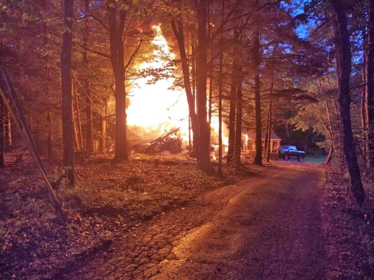 Fire engulfs a home at 1838 Dutch Neck Road in Waldoboro Thursday evening.
