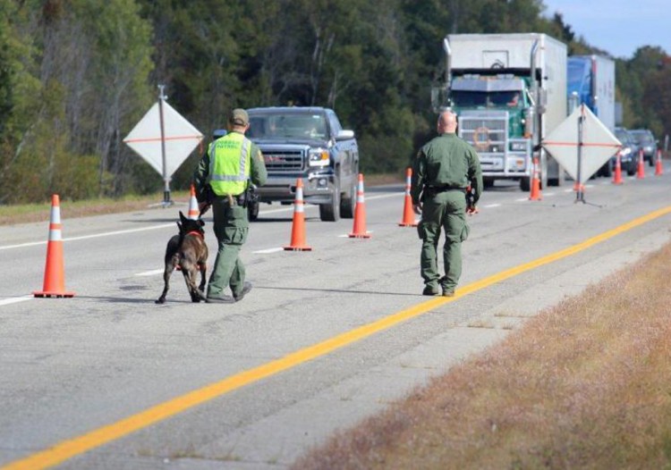 U.S. Border Patrol agents operate a citizenship checkpoint on June 21 along Interstate 95 between the Penobscot County towns of Howland and Lincoln. The federal agency has said it has been increasing its transportation checks across the country.