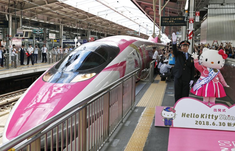  A Hello Kitty-themed "shinkansen" bullet train is unveiled at JR Shin Osaka station, in Osaka, western Japan, on Saturday.  