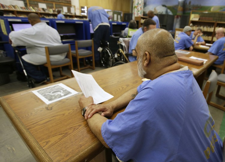Inmates use the library at the California Medical Facility in Vacaville, Calif. The facility is one of the California prisons where general population inmates are expected to peacefully coexist alongside inmates formerly housed at so-called Sensitive Needs Yards.
