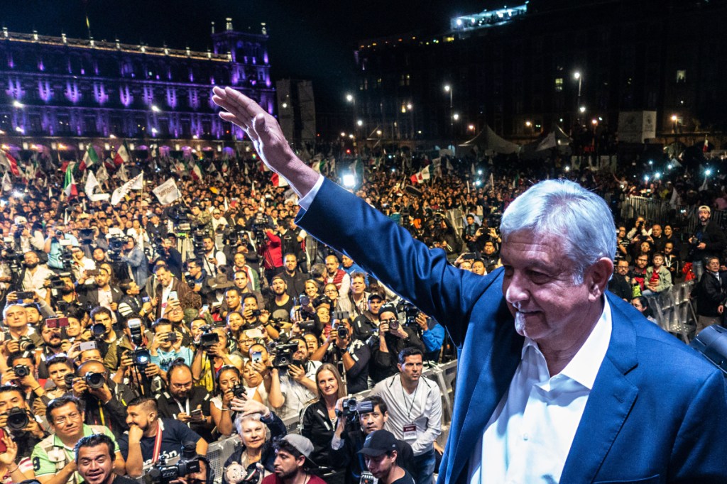 Andres Manuel Lopez Obrador, winner of Mexico's presidential election, waves during a rally at Zocalo square in Mexico City on July 1.