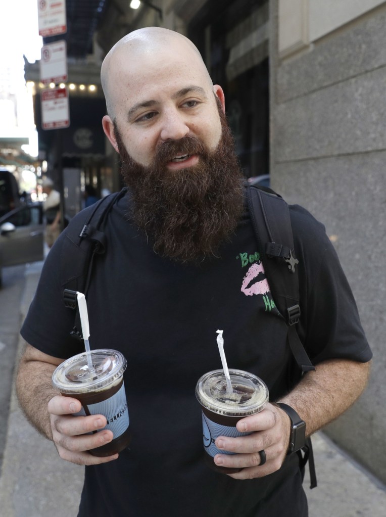 Adam Taylor, a sound engineer from Las Vegas who bought iced coffees for friends Monday in Chicago: "Coffee makes you happy" and is something to look forward to in the morning.