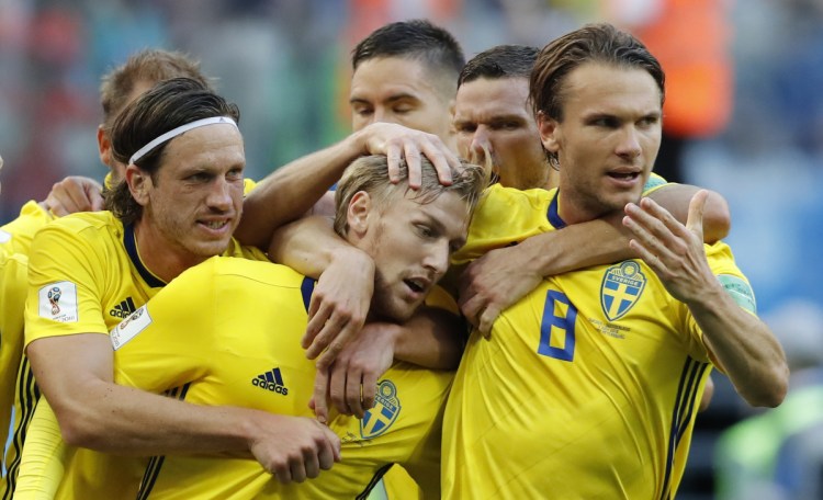 Sweden's Emil Forsberg, center, celebrates with teammates after scoring a goal during the match between Switzerland and Sweden at the 2018 World Cup in St. Petersburg, Russia on Tuesday.
