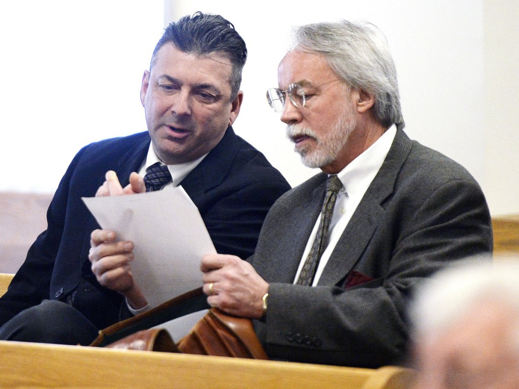 Former Ogunquit Town Manager Thomas Fortier, left, confers with attorney Bruce Merrill in March. A York County jury could not reach a verdict in the initial case on theft and official suppression charges.