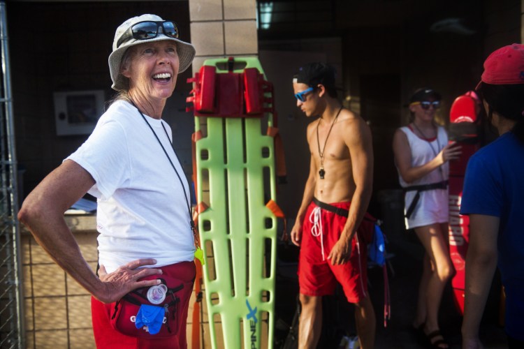 Leslie Botts and her fellow lifeguards close the Balcones neighborhood pool in Austin for the evening. 