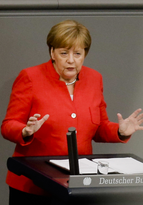 Chancellor Angela Merkel makes points Wednesday during a budget debate at the German parliament.