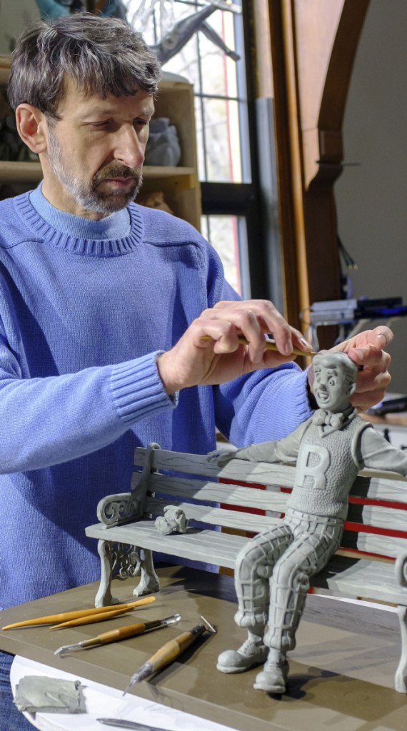 Sculptor Valery Mahuchy works on a clay model for his bronze statue of Archie in April 2017 at his studio in Bethlehem, N.H.