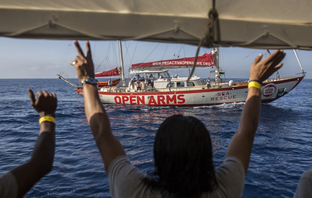 The Open Arms approach to Barcelona is followed by lawmakers aboard the Astral, a sister boat run by the same organization on Wednesday.