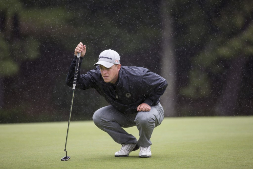 Jack Wyman lines up his shot as the rain comes down during the final round of the 2017 Maine Amateur golf tournament at the Brunswick Golf Club. Wyman, of South Freeport, who plays out of the Portland Country Club, won the tournament. (Staff photo by Brianna Soukup/Staff Photographer)