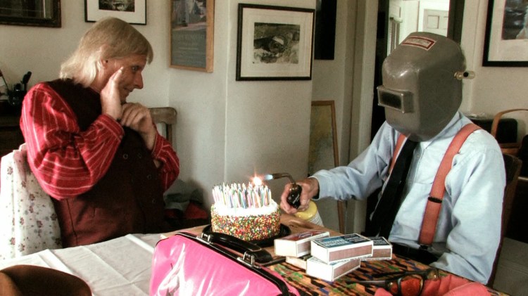 The humble Farmer lights the candles on a recent birthday cake.