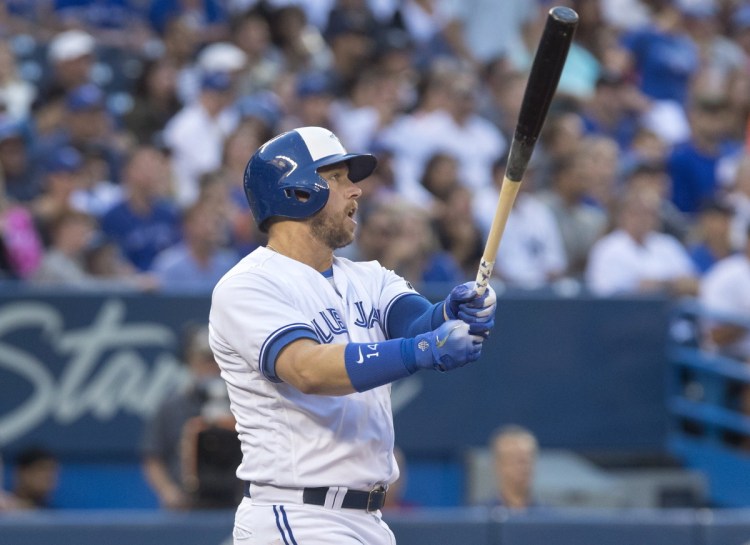 Justin Smoak of the Toronto Blue Jays watches his three-run homer leave the park Friday night in the second inning of the 6-2 victory against the New York Yankees.
