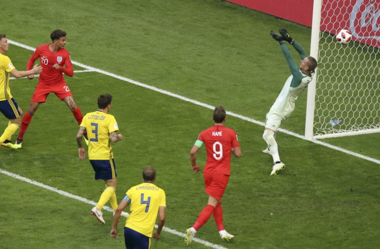 England's Dele Alli, second from the left, scores his side's second goal during the quarterfinal match between Sweden and England at the 2018 World Cup in Samara, Russia on Saturday. England will face Croatia in the semifinals Wednesday.