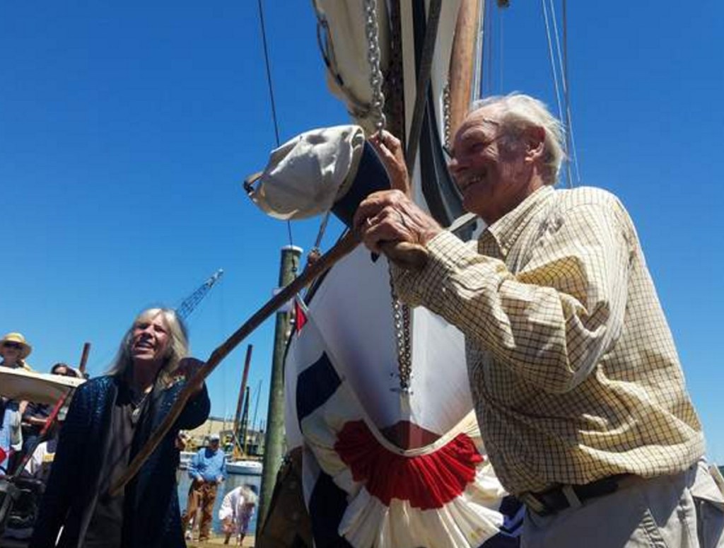 Capt. Jim Sharp and his wife, Meg Sharp, prepare for the launching of the Blackjack. She christened the sloop.