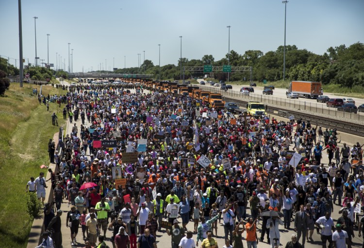 Thousands of anti-violence protesters pour into the inbound lanes of Interstate 94, known as the Dan Ryan Expressway, on Saturday in Chicago. 