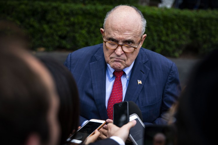 Rudy Giuliani speaks with reporters on the South Lawn of the White House in Washington on May 30.