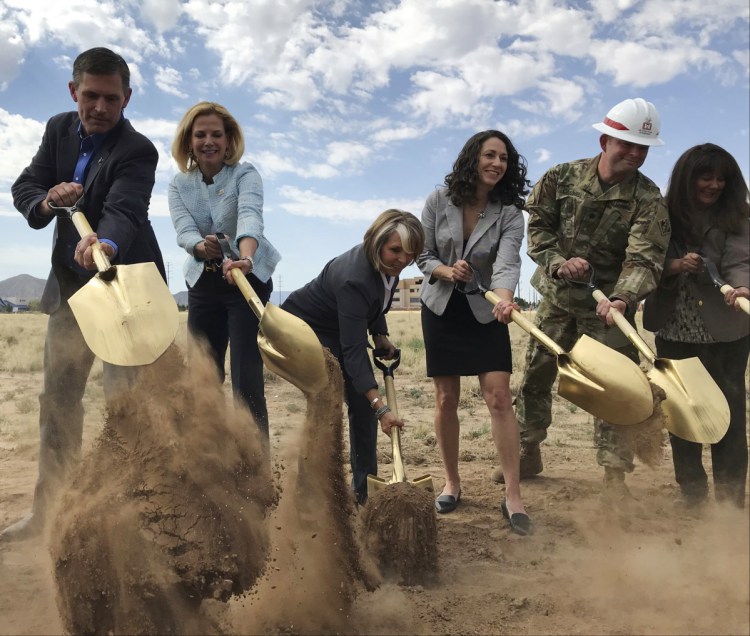 Democratic U.S. Sen. Martin Heinrich of New Mexico, from left, U.S. Energy Under Secretary for Nuclear Security Lisa Gordon-Hagerty, Democratic Rep. Michelle Lujan Grisham and other officials break ground for a new multimillion-dollar office building in Albuquerque, N.M., on Monday. The new complex will house employees of the National Nuclear Security Administration.