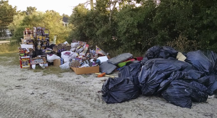 Debris gathered by town workers on the day after the Fourth of July, much of it fireworks packaging and remnants, sits along Pine Point Beach in Scarborough. Beach neighbor Karen D'Andrea posted photos online and railed against the mess, drawing scores of comments. 