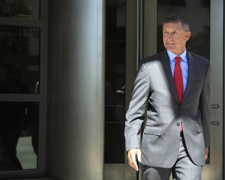 Former Trump national security adviser Michael Flynn leaves a federal courthouse in Washington on Tuesday following a status hearing.