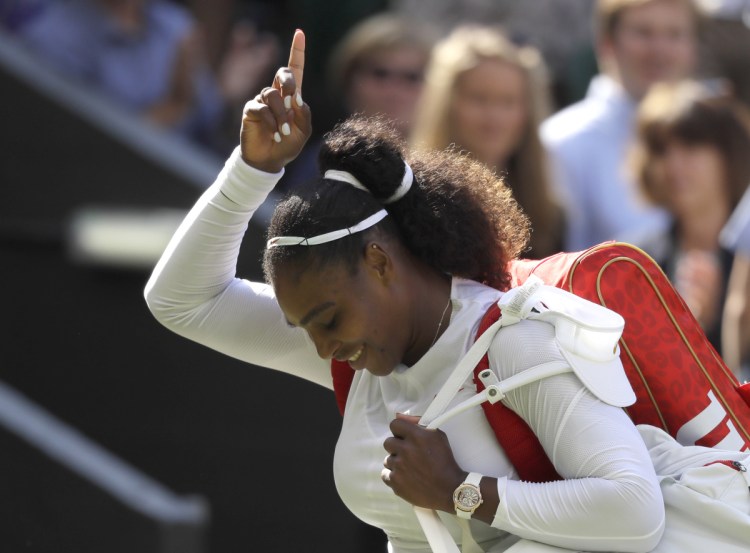 Serena Williams celebrates her quarterfinal victory against Italy's Camila Giorgi on Tuesday at the Wimbledon tennis championships in London.