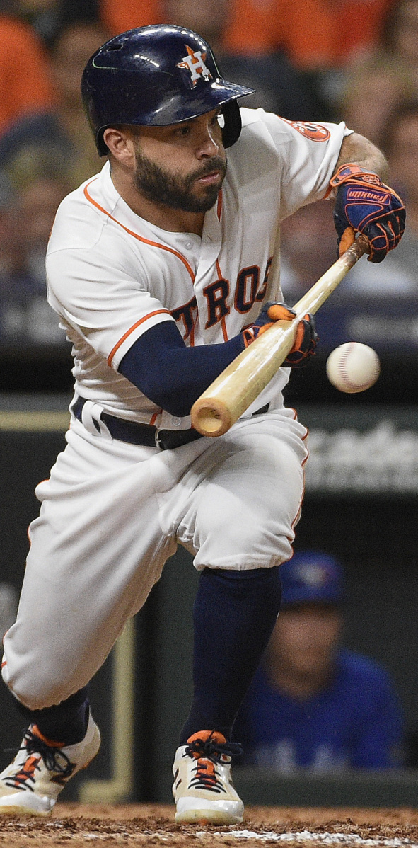 Jose Altuve of the Astros lays down a sacrifice bunt during a game against Toronto on June 26. Teams sacrifice less than half as often as 25 years ago.