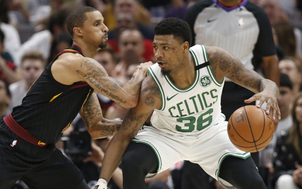 Marcus Smart, right, is definitely the type of gritty player that the Boston Celtics like, but they don't want to give a multiyear deal when a matching offer would keep him this season.