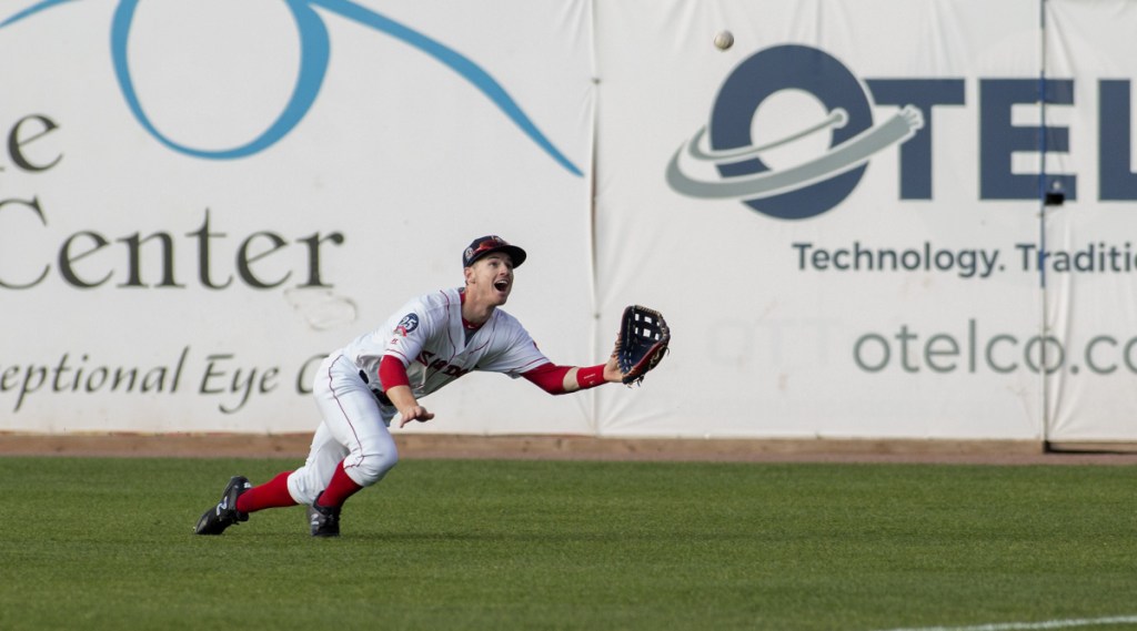 Right fielder Danny Mars of the Sea Dogs dives to haul in the ball at Hadlock Field. Portland defeated New Hampshire, 5-4.