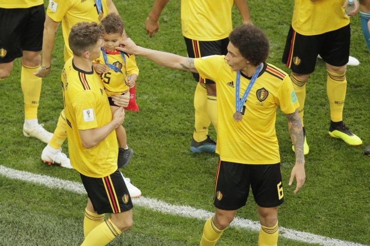 Belgium's Axel Witsel, right, and his teammates leave the pitch after winning their third place match against England at the 2018 World Cup in the St. Petersburg Stadium in Russia on Saturday. Belgium defeats England 2-0.