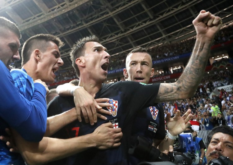 Mario Mandzukic, center, scored the extra-time winner versus England for Croatia, which has made a habit of comebacks.