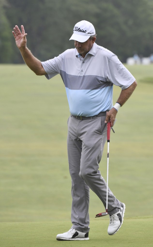 Bart Bryant waves to the gallery Saturday after he closed out a 65 for a share of the lead in the Constellation Senior Players Championship in Highland Park, Ill.