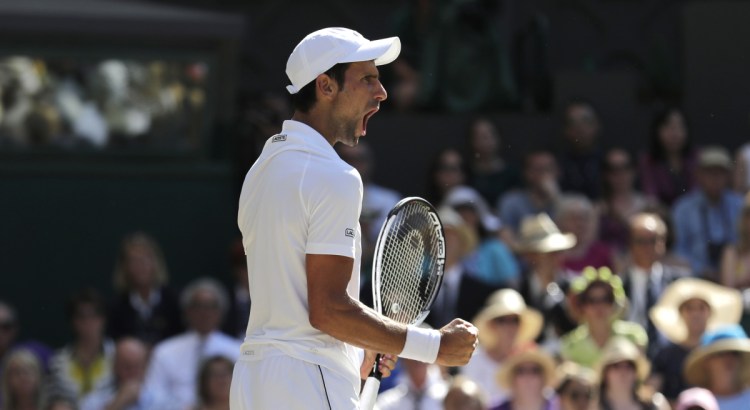 Serbia's Novak Djokovic celebrates winning a game in the final against Kevin Anderson of South Africa at Wimbledon in London on Sunday.